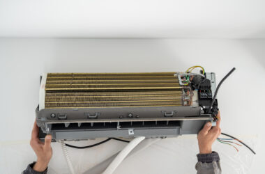 Installation air conditioning system in room with white wall in apartment, office closeup